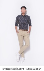 Young Man Isolated On White Background Wearing Fashion Shirts And Khaki Pants Full Body, Full Length


