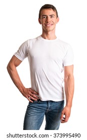 Young Man In Jeans And Tee Shirt. Studio Shot Over White.