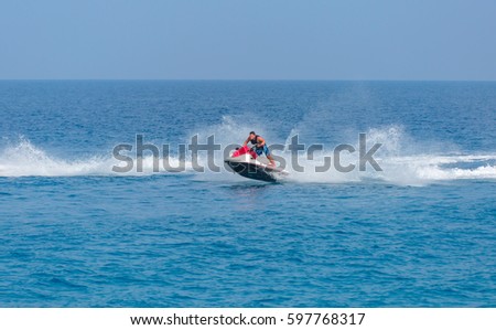 Young man of jet ski rider performs on the waves with much splashes -  Man on jet ski jump on the wave - Alanya, Turkey
