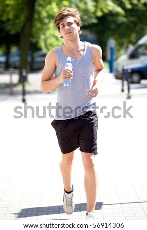 Similar – Image, Stock Photo Young sportsman drinking water after jogging