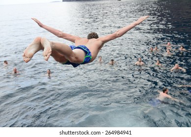 Young Man Jumping In The Water