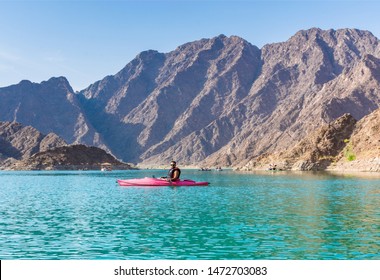 Young Man Kayaking In Hatta Dam Best Water Sports Adventure Activities In Dubai, Famous Travel And Tourism Spot In Dubai