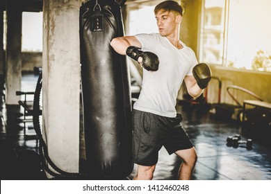 Young Man Kick Boxing Workout In Gym,muay Thai 