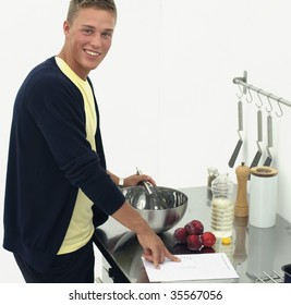 Young man in kitchen