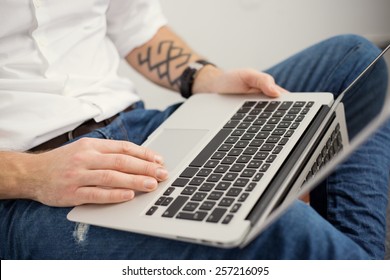 Young man with laptop computer