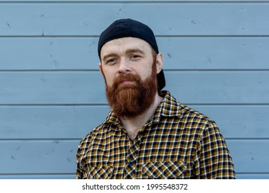 A Young Man With A Large Red Beard.