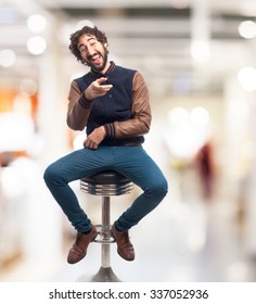 Young Man Laughing With Bar Stool