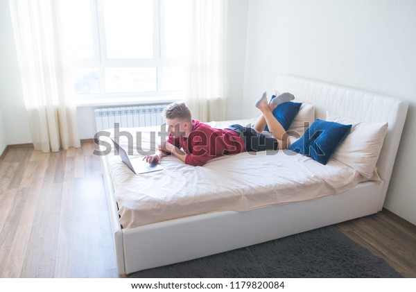 Young Man Lays On Bed Bedroom Stock Photo Edit Now 1179820084