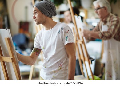 Young Man Learning To Draw At Art Class