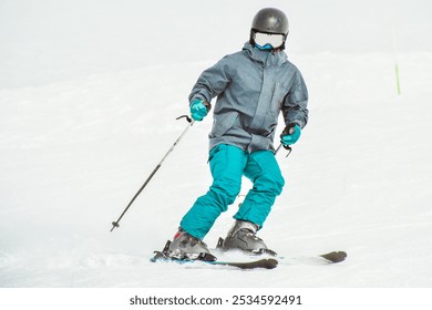 Young man learning to ski on a snowy slope close up front view isolated pose - Powered by Shutterstock