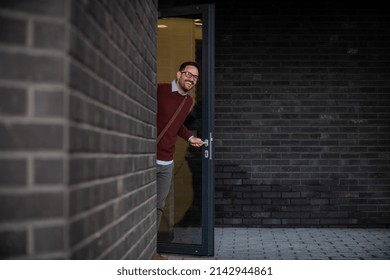 Young Man Leaving His Apartment For Work
