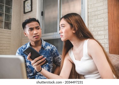 A Young Man Lets His Girlfriend Know That He Demands Attention. A Guy Slightly Irritated That His Partner Is Always Busy On The Phone. Asking For Quality Time.