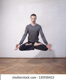 Young Man Levitating In Yoga Position, Meditation