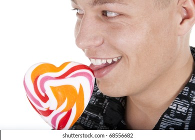 The Young Man Is Licking A Lolly Pop