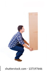 Young Man Lifting A Cardboard Box, Isolated On White Background