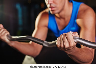 Young Man Lifting Weight During Workout