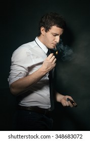 Young man light up cigarettes
