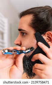 Young Man With A Long Beard, Shaving With A Safety Razor