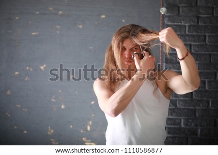 Similar – Image, Stock Photo Close up front portrait of one young middle age athletic woman in sportswear in gym over dark background, standing in boxing stance with hands and fists, looking at camera