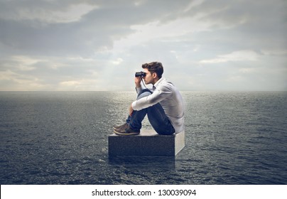 Young Man Looking With Binoculars