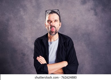 Young Man Looking Cheeky Camera Showing Stock Photo 762624880 