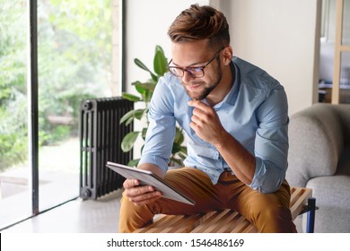 Young Man looking at digital tablet	 - Shutterstock ID 1546486169