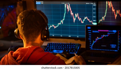 young man looking at graph screen