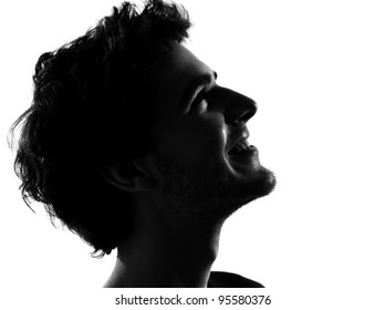 Young Man Looking Up Portrait Silhouette In Studio Isolated On White Background