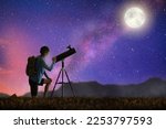 Young man looking at stars through telescope. Camping and hiking fun. Outdoor astronomy hobby. Teenager watching night sky with milky way. Teen observing planets and moon. Nature exploration.