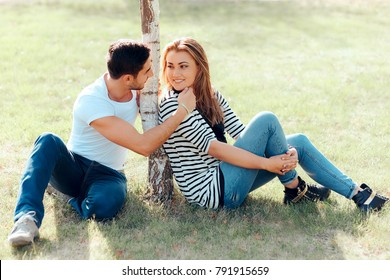 Young Man In Love Flirting With A Beautiful Girl In Outdoor Date
Romantic Guy Making Affectionate Gesture Towards His New Crush
