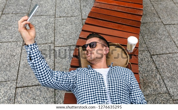 Young Man Lying On Park Bench Stock Photo Edit Now 1276635295