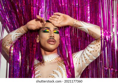 Young Man Made Up Drag Queen Artist With Closed Eyes With Colorful Background