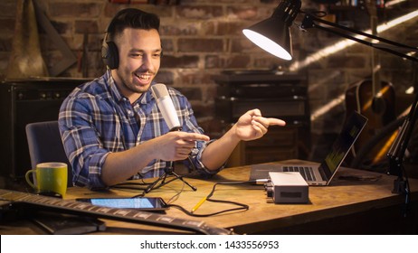 Young man makes a podcast audio recording at home in a garage. - Powered by Shutterstock