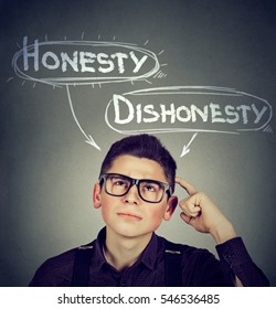 Young Man Making A Decision Honesty Vs Dishonesty  