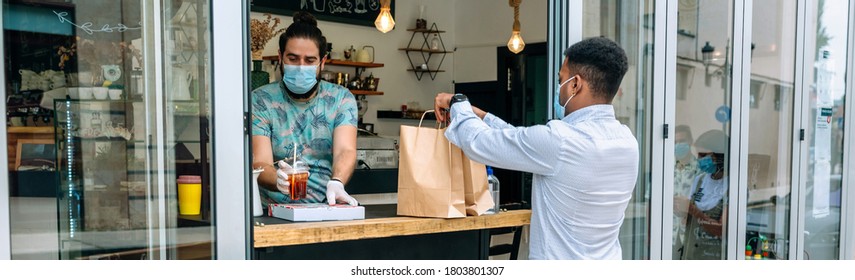Young man with mask picking up a take away food order