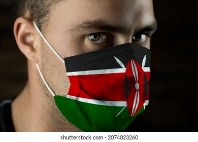 Young Man In A Medical Mask With The Flag Of Kenya On The Mask