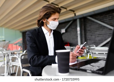 Young Man In A Medical Mask Outside, No Money, Crisis, Poverty, Hardship, Isolation.