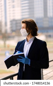 Young Man In A Medical Mask Outside, No Money, Crisis, Poverty, Hardship, Isolation.