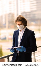 Young Man In A Medical Mask Outside, No Money, Crisis, Poverty, Hardship, Isolation.