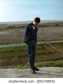 Young Man Model In A Double Denim Stylish Outfit Captured In The Nature