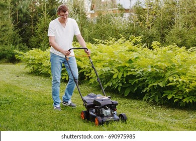 Young Man Mows Lawn Stock Photo 690975985 