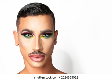 young man with mustache and makeup with glamorous look on white background