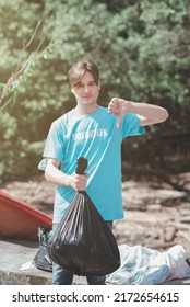 A Young Man, A Nature Conservationist, Walks To Collect Trash In The Mangrove Forest.