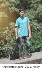 A Young Man, A Nature Conservationist, Walks To Collect Trash In The Mangrove Forest.