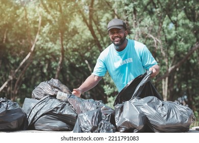 A Young Man, A Nature Conservationist, Walks To Collect Trash In The Mangrove Forest.