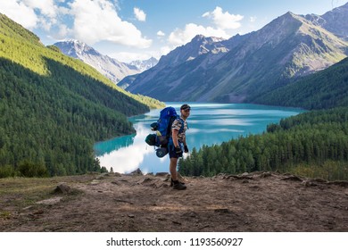 Young man in nature in the mountains, natural photos - Shutterstock ID 1193560927
