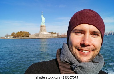 Young Man In New York, In Background The Statue Of Liberty