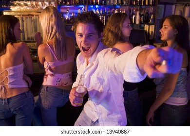 Young man in nightclub showing off for the camera