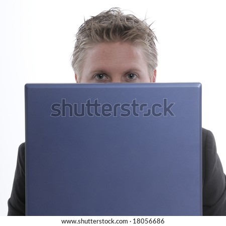 a young man with a notebook is hard working