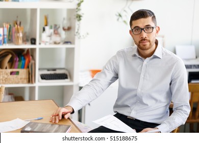 Young man in offfice - Shutterstock ID 515188675